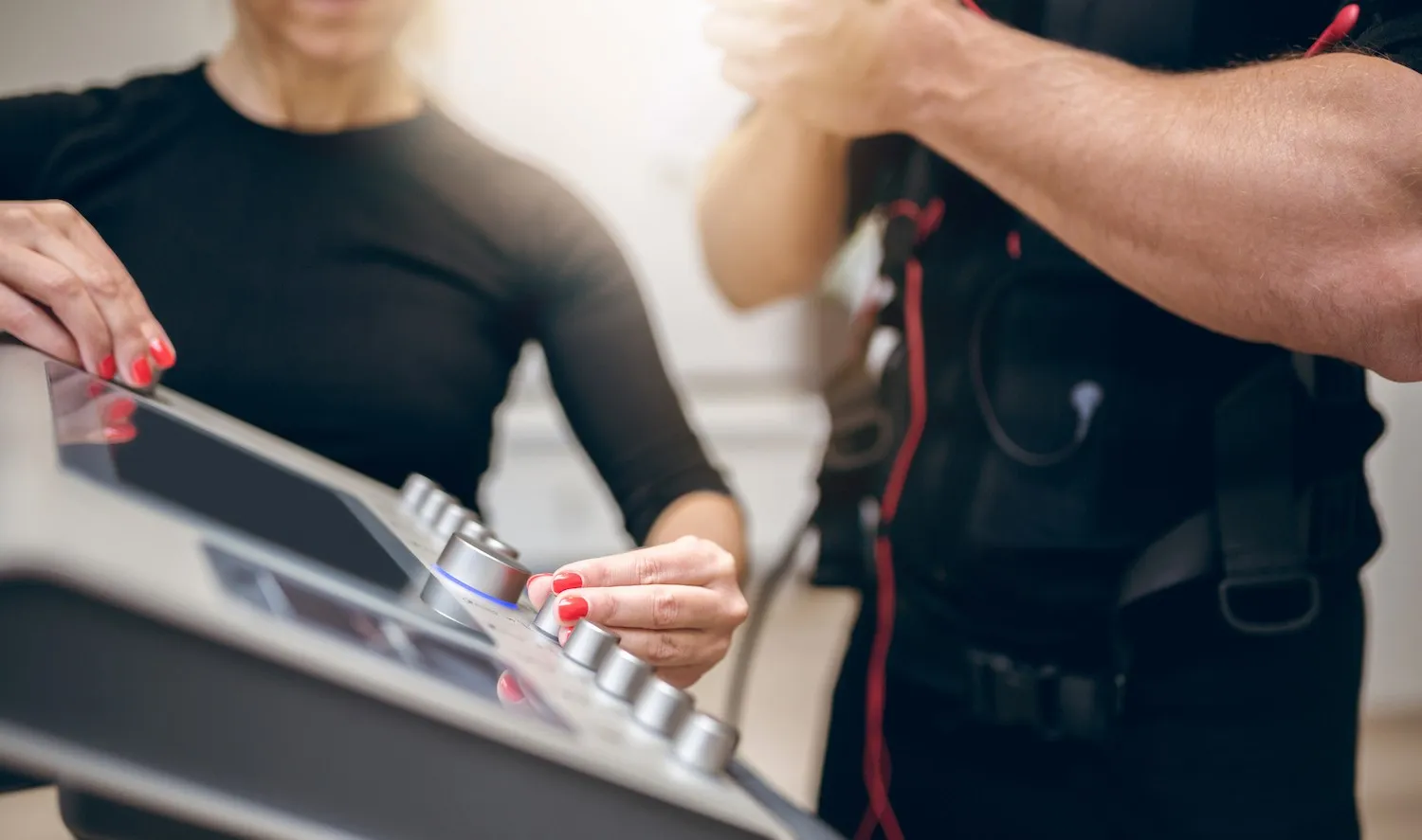 Trainer setting up the EMS device for a training session